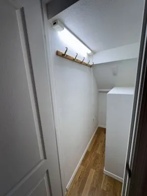 Finished closet under the stairs with interior lighting